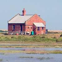 The Blakeney Point Watch House on a high Spring tide