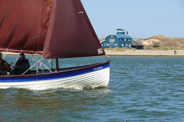 Stiffkey Cockle passing in front of the lifeboat house